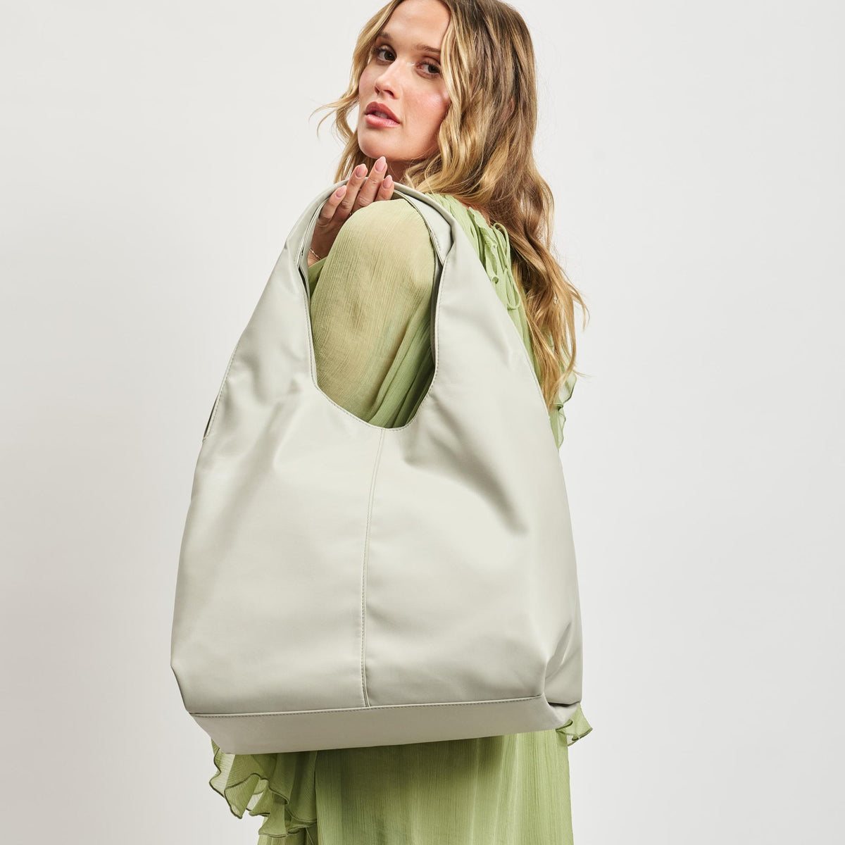 Woman wearing Bone Moda Luxe Faye Hobo 842017138778 View 1 | Bone
