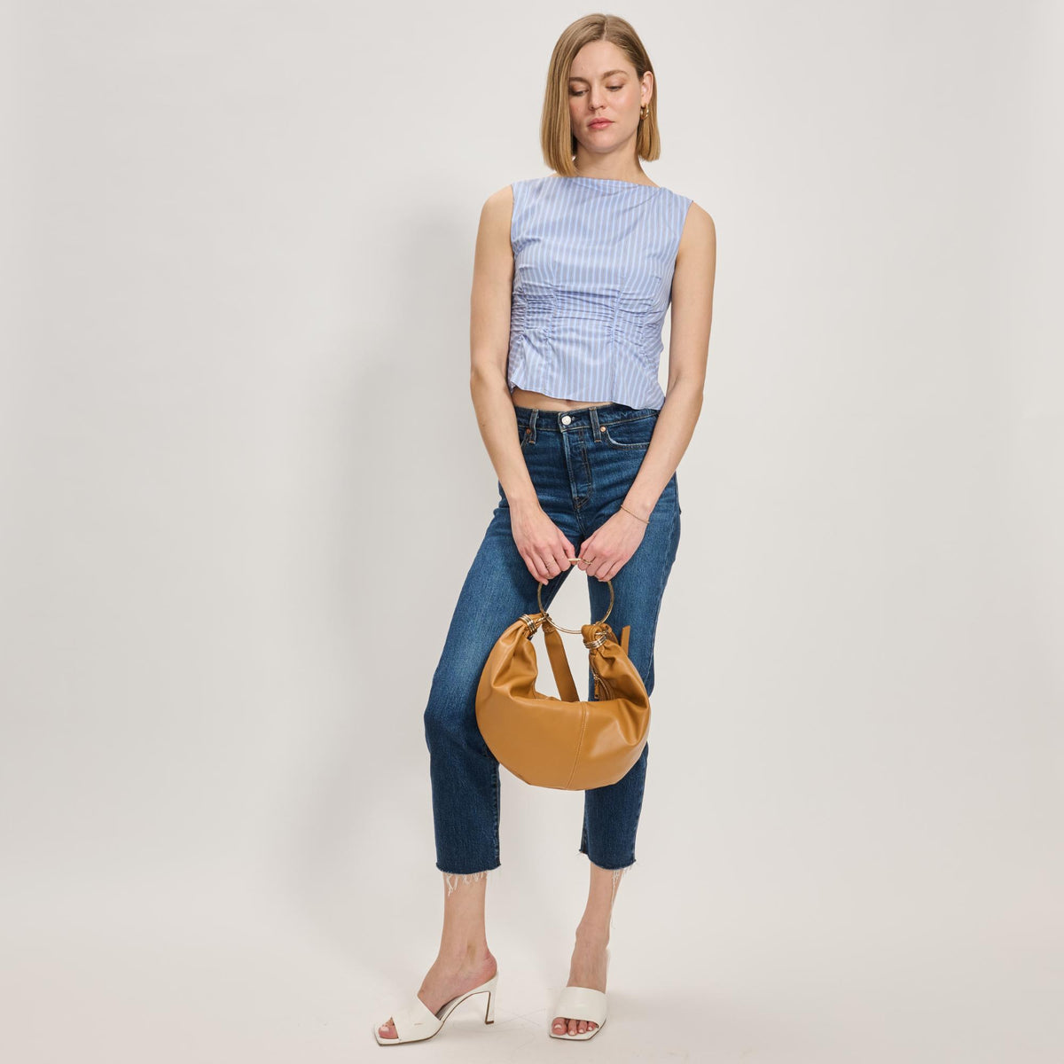 Woman wearing Tan Moda Luxe Azura Crossbody 842017138006 View 4 | Tan