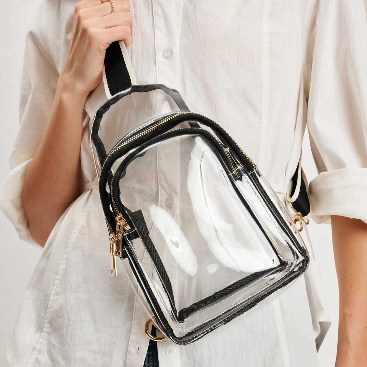 Woman wearing Clear Black Moda Luxe Britney Sling Backpack 842017133513 View 2 | Clear Black