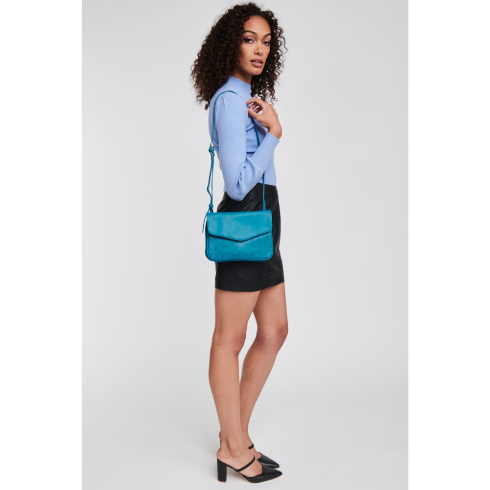 Woman wearing Teal Moda Luxe Tate-Perf Crossbody 842017121404 View 3 | Teal