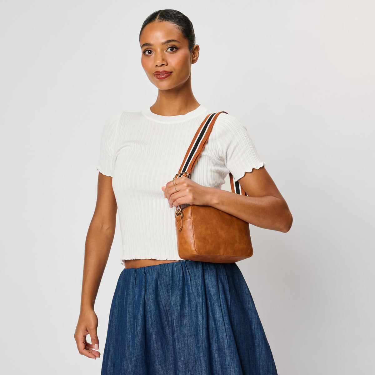 Woman wearing Tan Moda Luxe Skylie Crossbody 842017126706 View 2 | Tan
