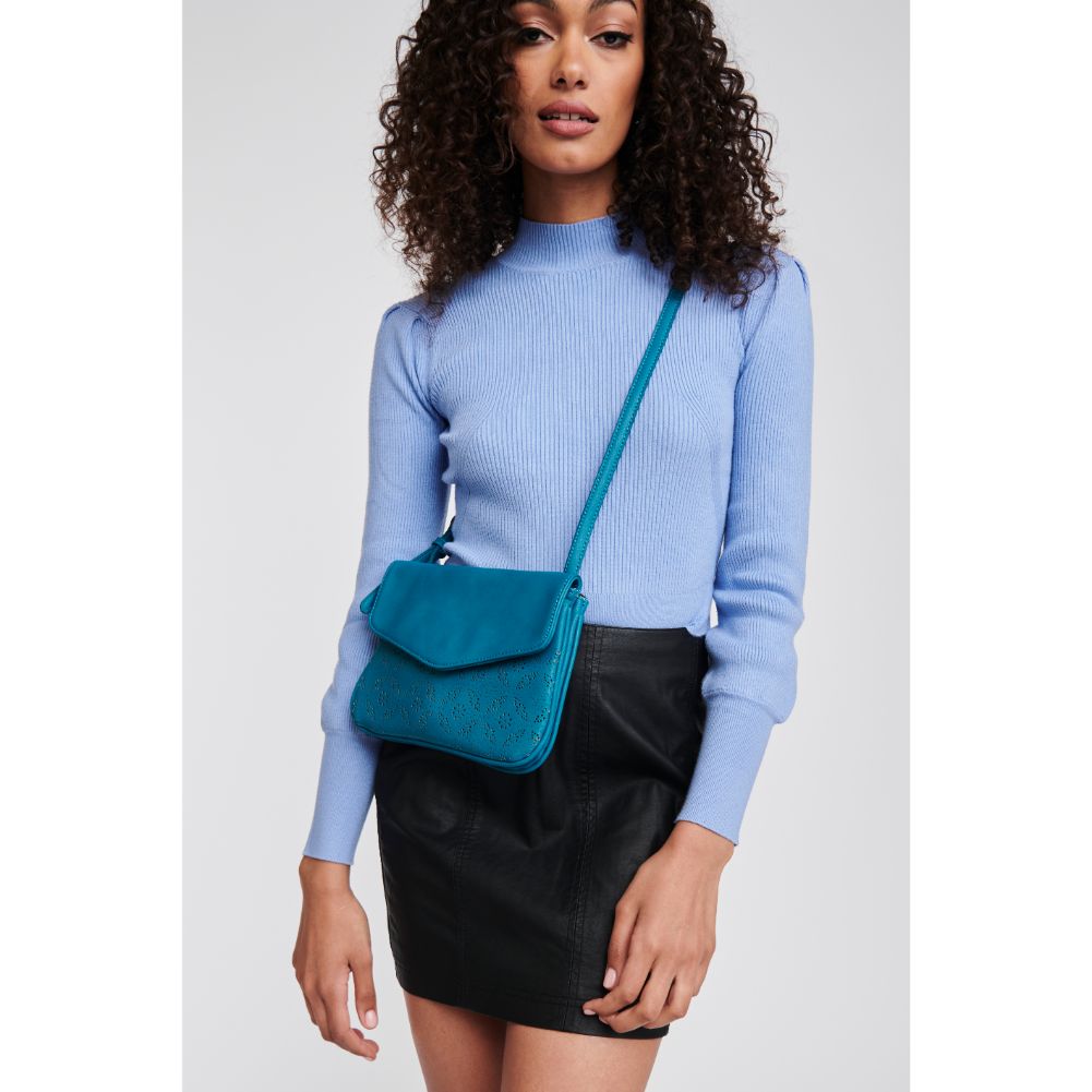 Woman wearing Teal Moda Luxe Tate-Perf Crossbody 842017121404 View 1 | Teal
