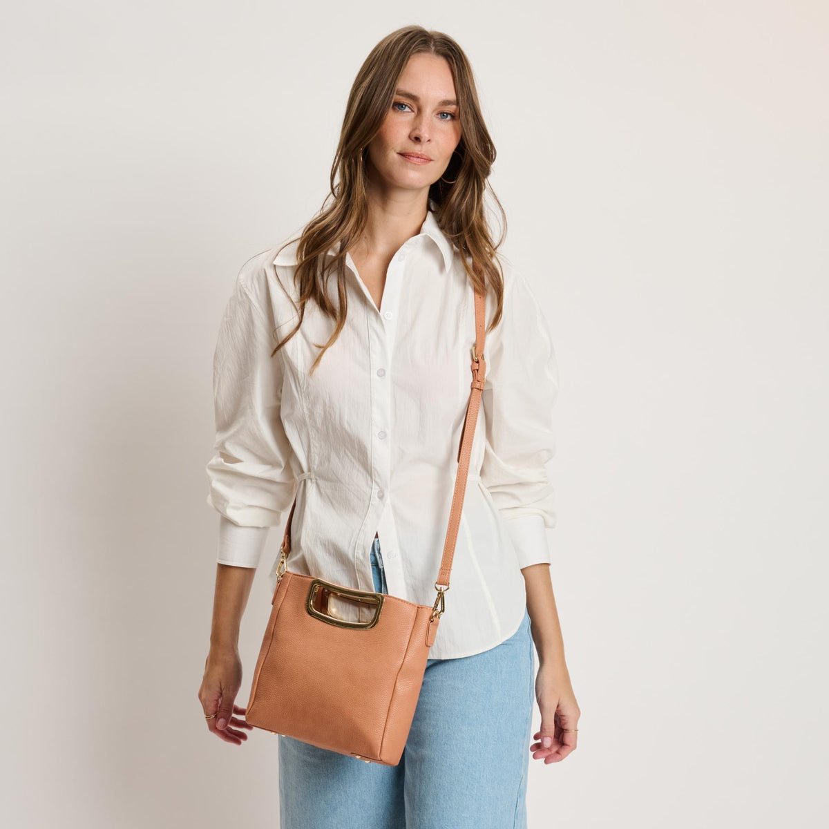 Woman wearing Salmon Moda Luxe Brielle Crossbody 842017141501 View 3 | Salmon