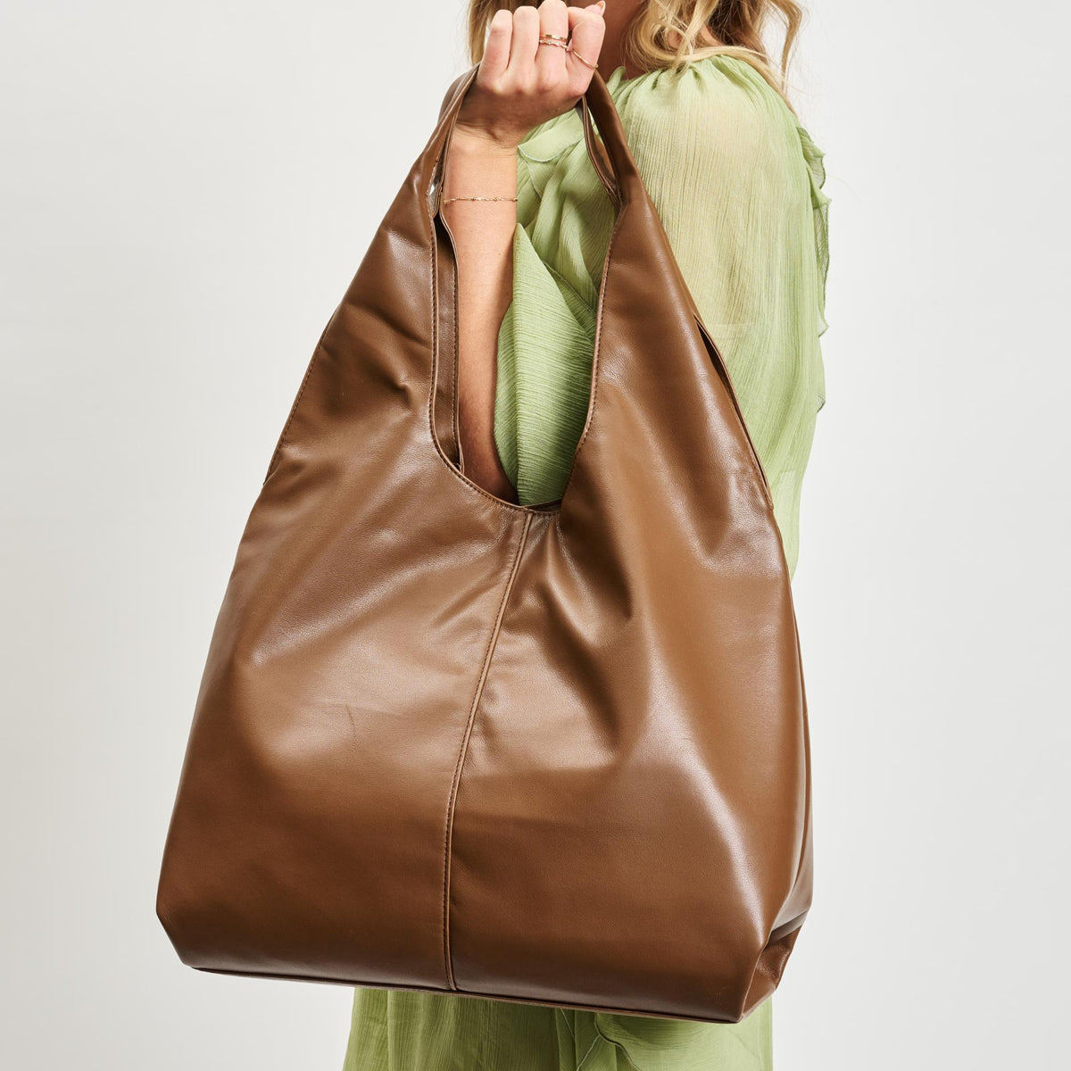 Woman wearing Chocolate Moda Luxe Faye Hobo 842017138785 View 4 | Chocolate