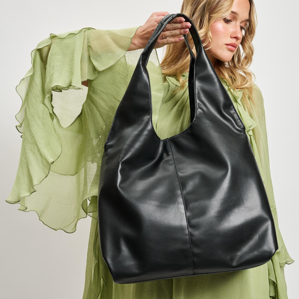 Woman wearing Black Moda Luxe Faye Hobo 842017138754 View 1 | Black