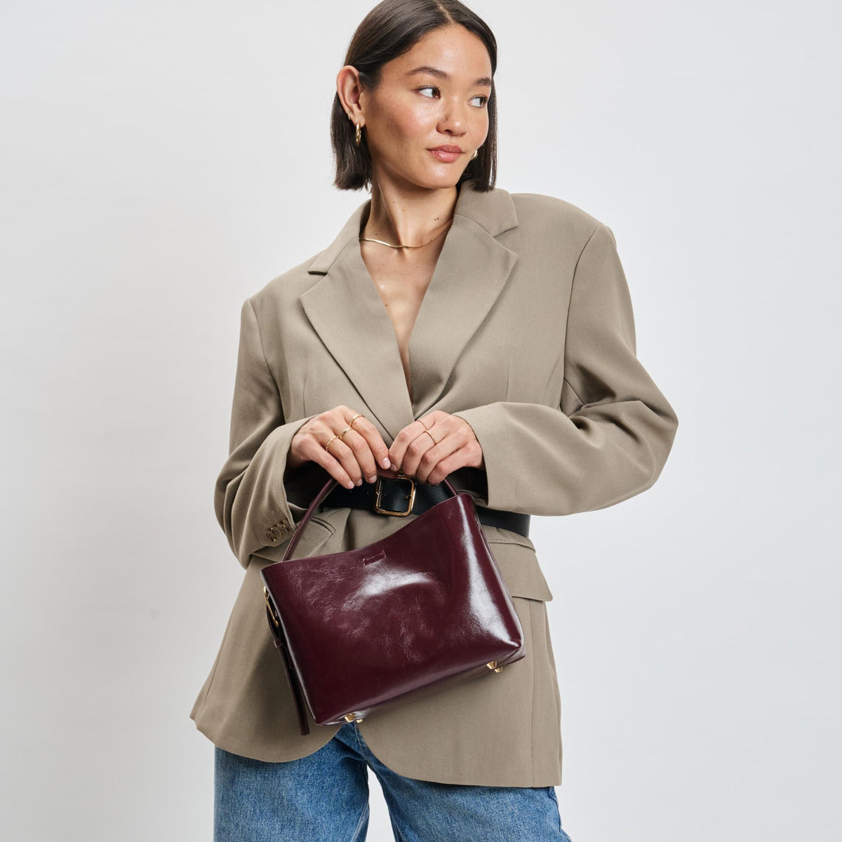 Woman wearing Burgundy Moda Luxe Sophie Crossbody 842017139485 View 1 | Burgundy