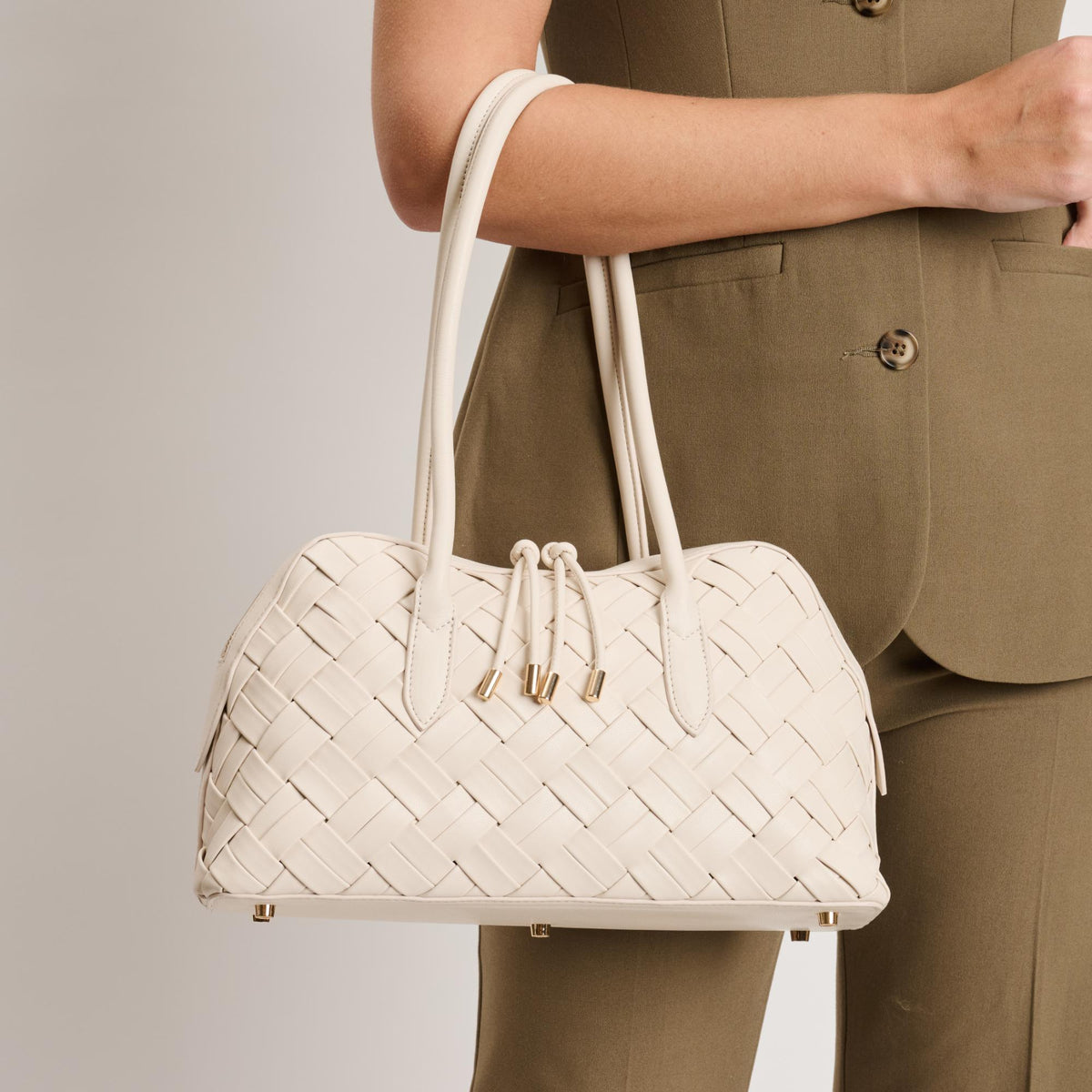 Woman wearing Oatmilk Moda Luxe Lotus Shoulder Bag 842017140801 View 1 | Oatmilk