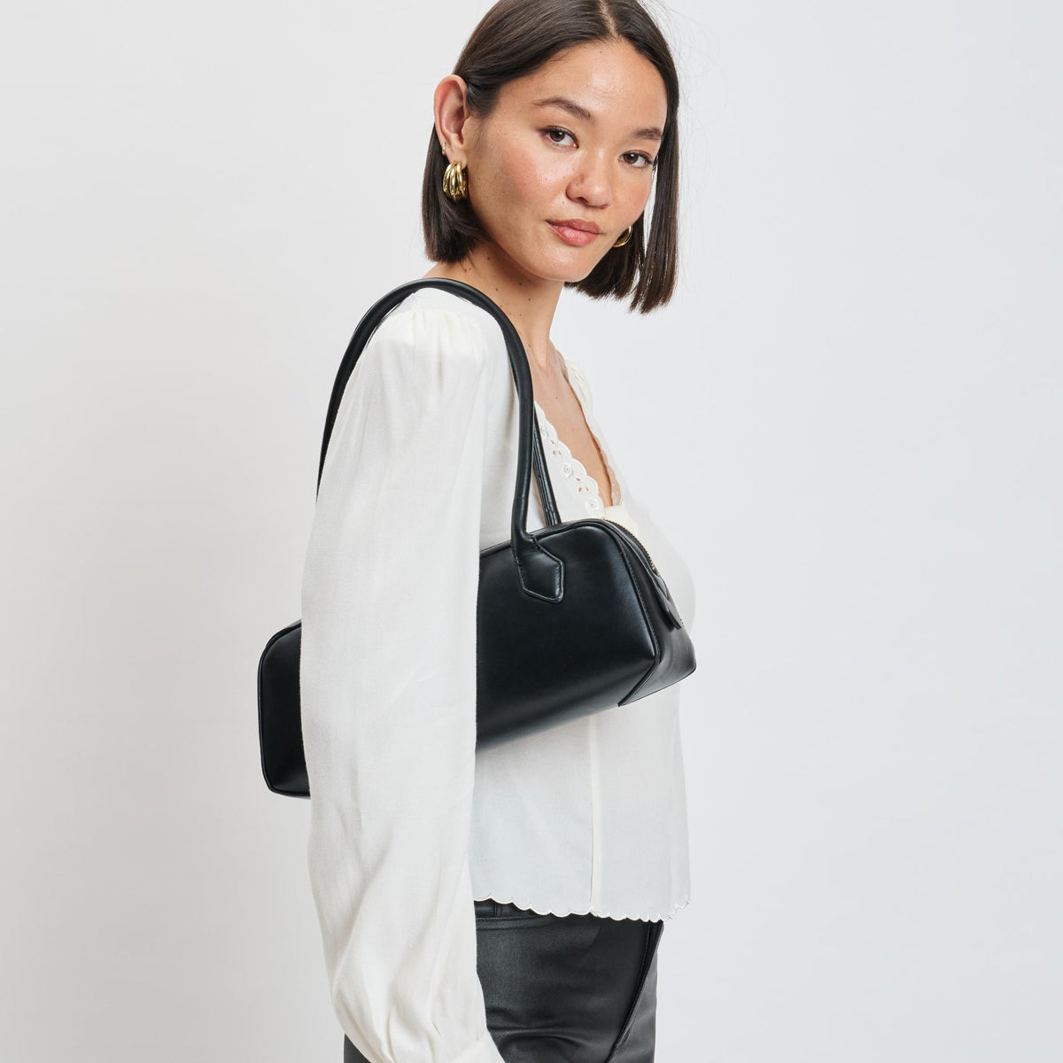 Woman wearing Black Moda Luxe Betty Shoulder Bag 842017139393 View 1 | Black