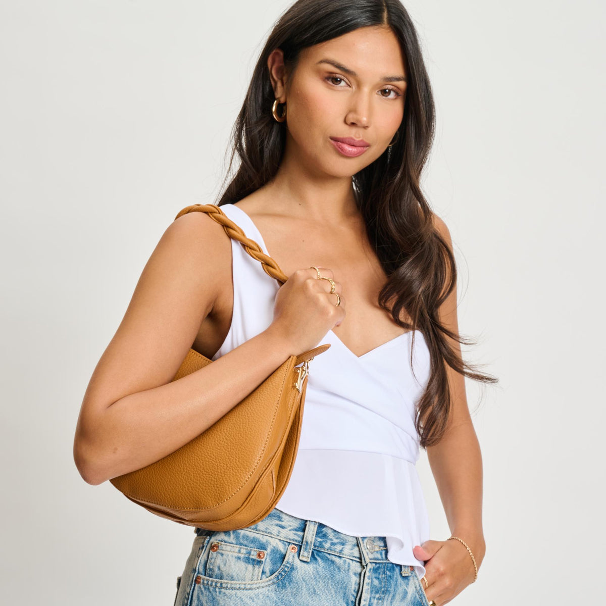Woman wearing Tan Moda Luxe Glamique Crossbody 842017134855 View 2 | Tan