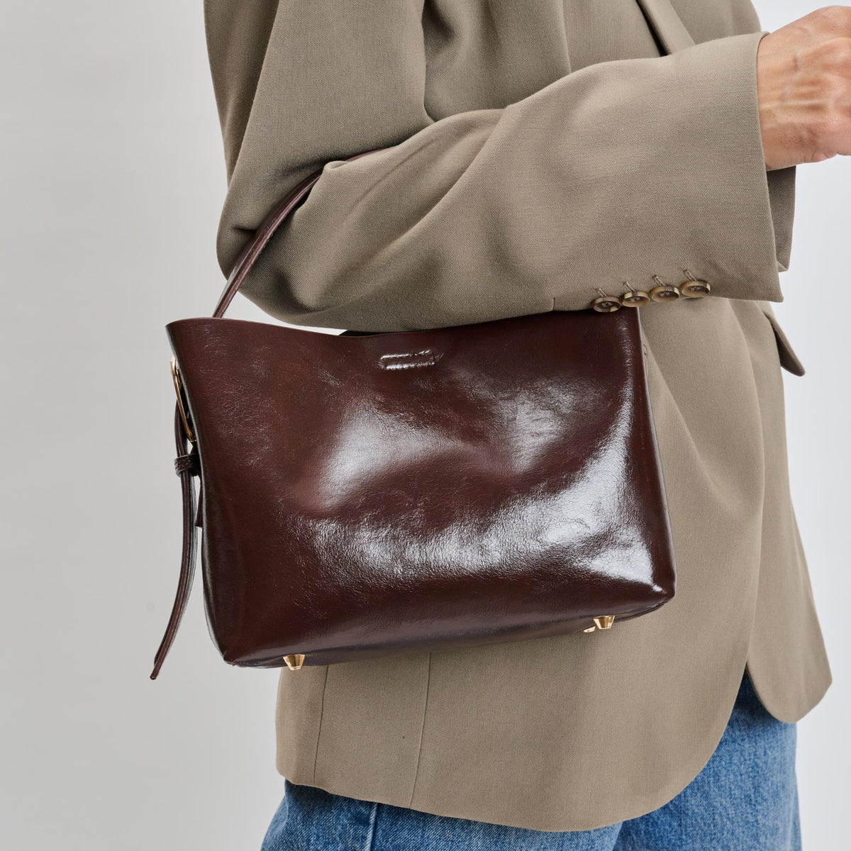 Woman wearing Chocolate Moda Luxe Sophie Crossbody 842017139508 View 4 | Chocolate