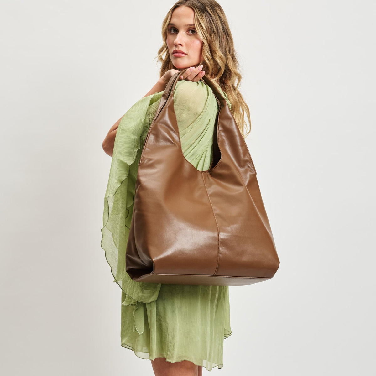Woman wearing Chocolate Moda Luxe Faye Hobo 842017138785 View 1 | Chocolate