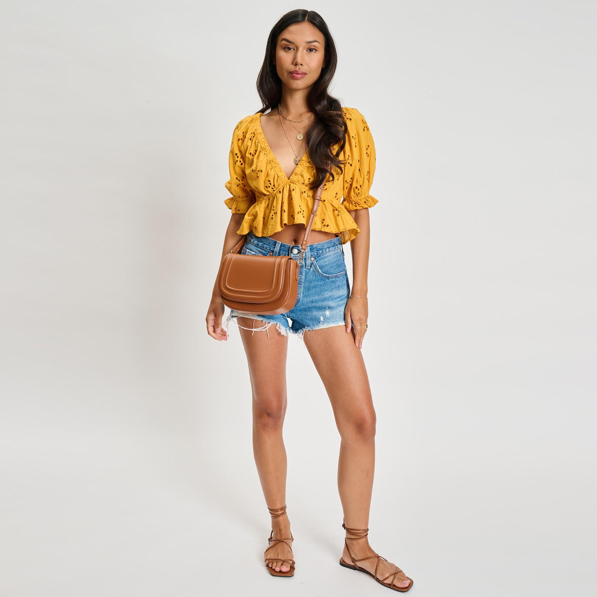 Woman wearing Tan Moda Luxe Poshette Crossbody 842017134749 View 4 | Tan