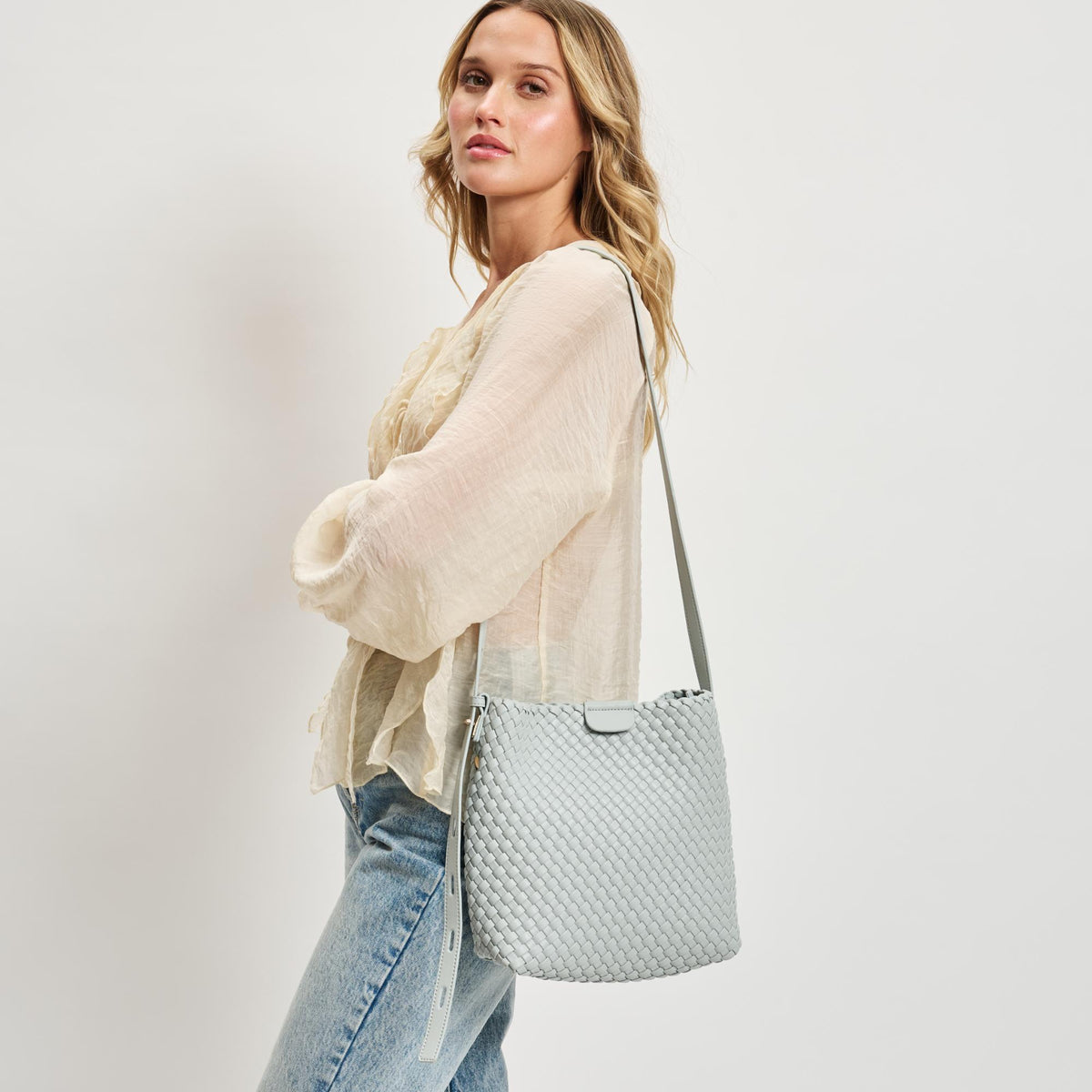 Woman wearing Ice Blue Moda Luxe Isadora Bucket 842017137344 View 1 | Ice Blue