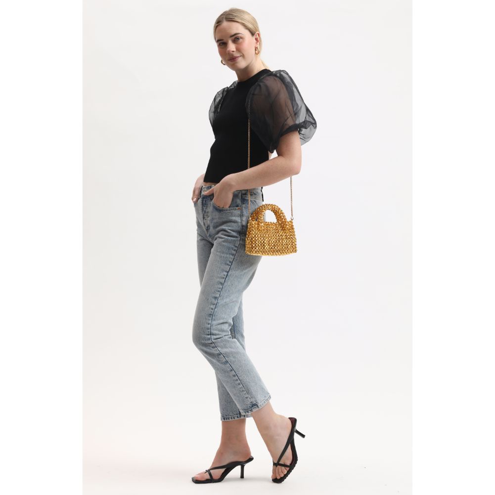 Woman wearing Gold Moda Luxe Kora Crossbody 842017134084 View 2 | Gold