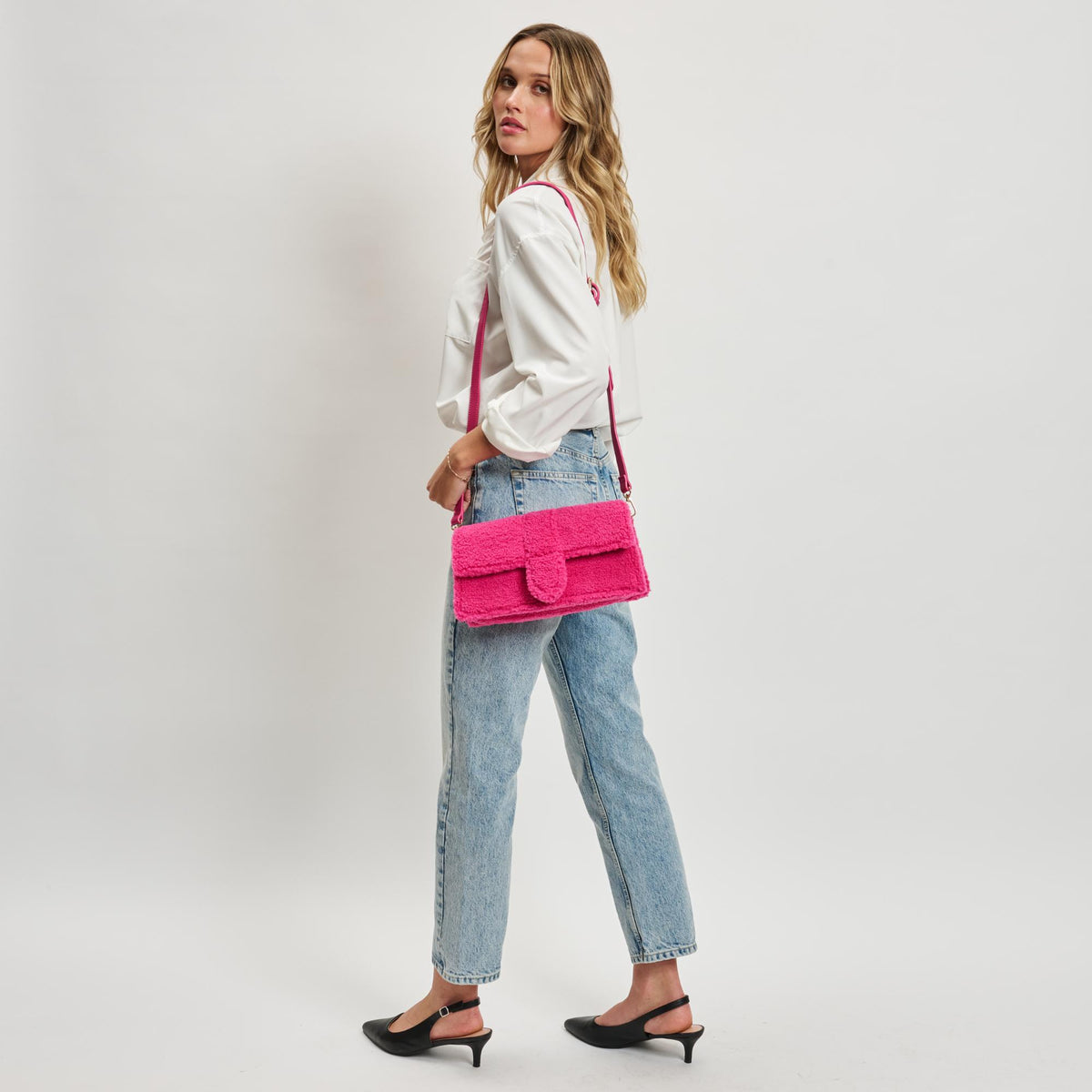 Woman wearing Hot Pink Moda Luxe Fergie Crossbody 842017133704 View 4 | Hot Pink