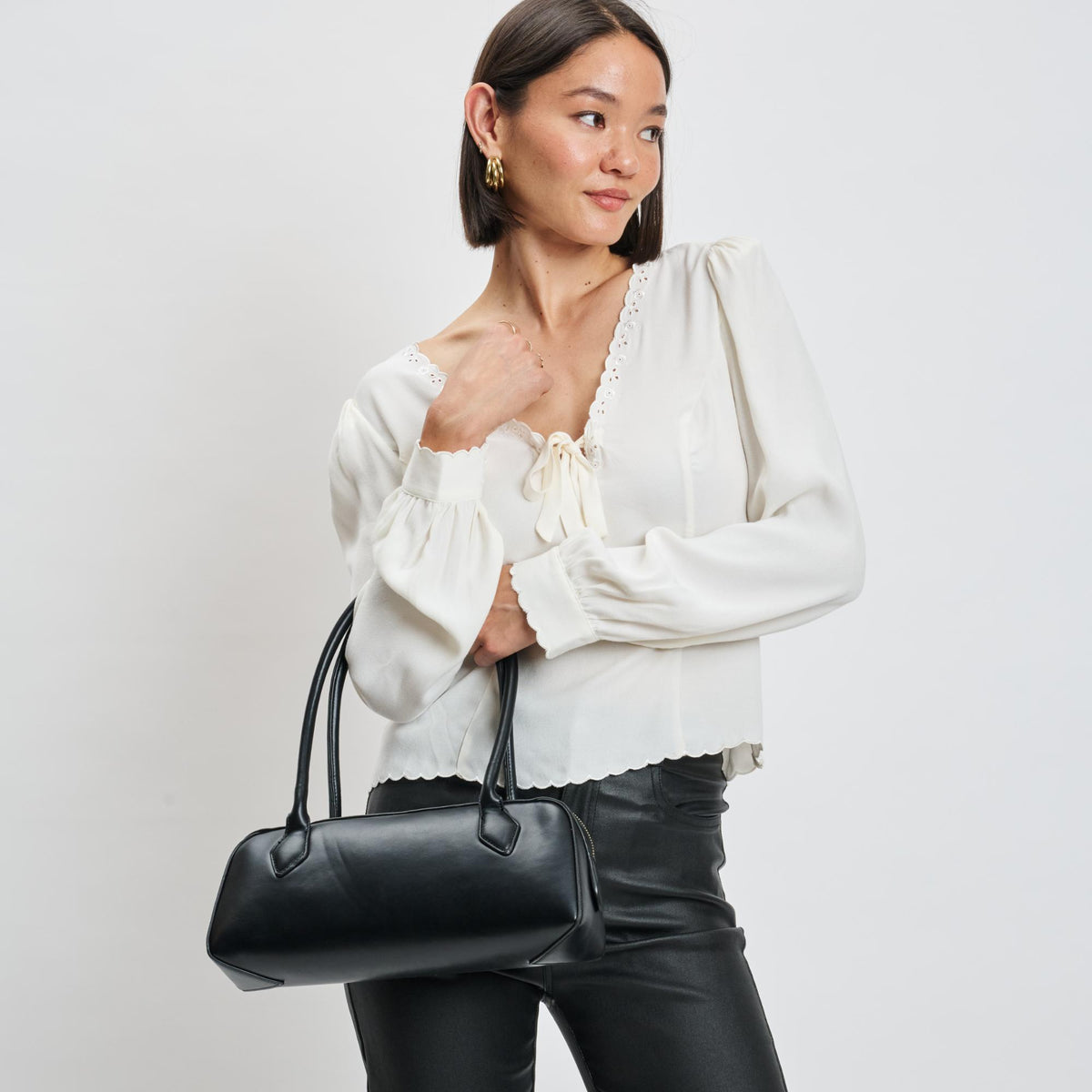 Woman wearing Black Moda Luxe Betty Shoulder Bag 842017139393 View 2 | Black