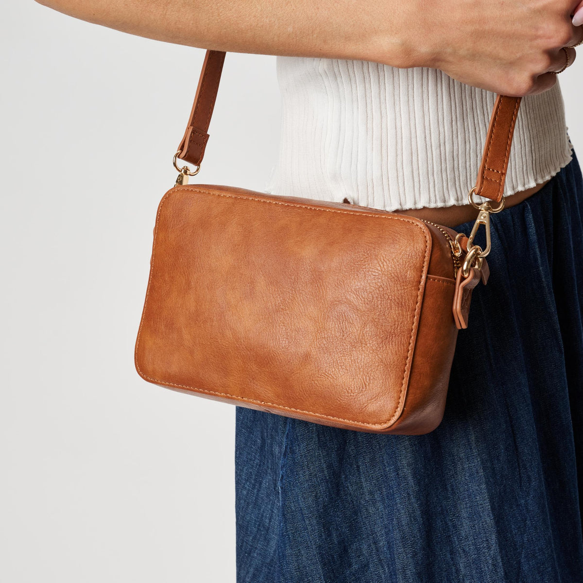 Woman wearing Tan Moda Luxe Skylie Crossbody 842017126706 View 4 | Tan