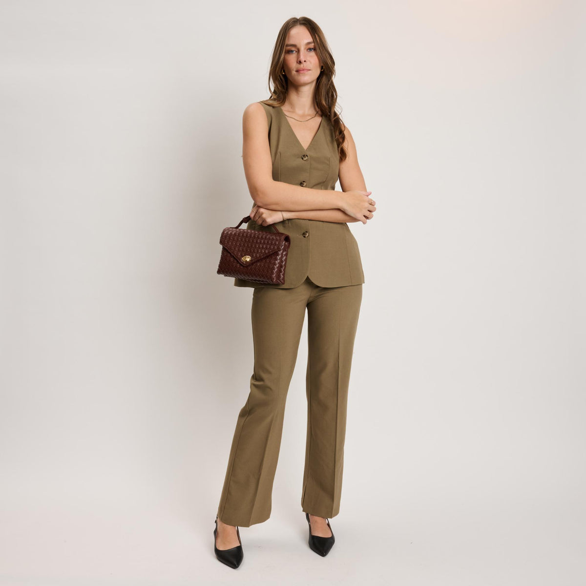 Woman wearing Chocolate Moda Luxe Harper Crossbody 842017139324 View 4 | Chocolate