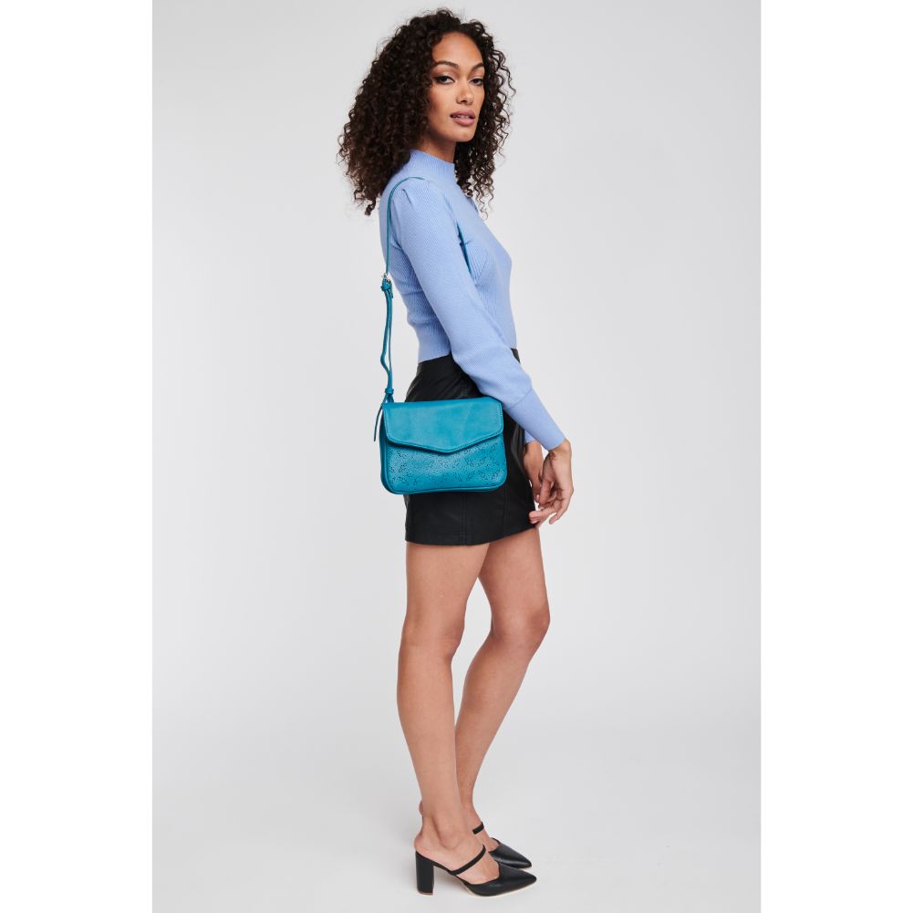 Woman wearing Teal Moda Luxe Tate-Perf Crossbody 842017121404 View 4 | Teal