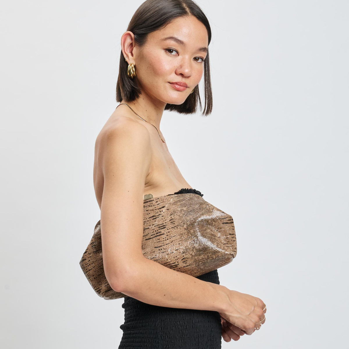 Woman wearing Brown Moda Luxe Camille Clutch 842017139201 View 2 | Brown
