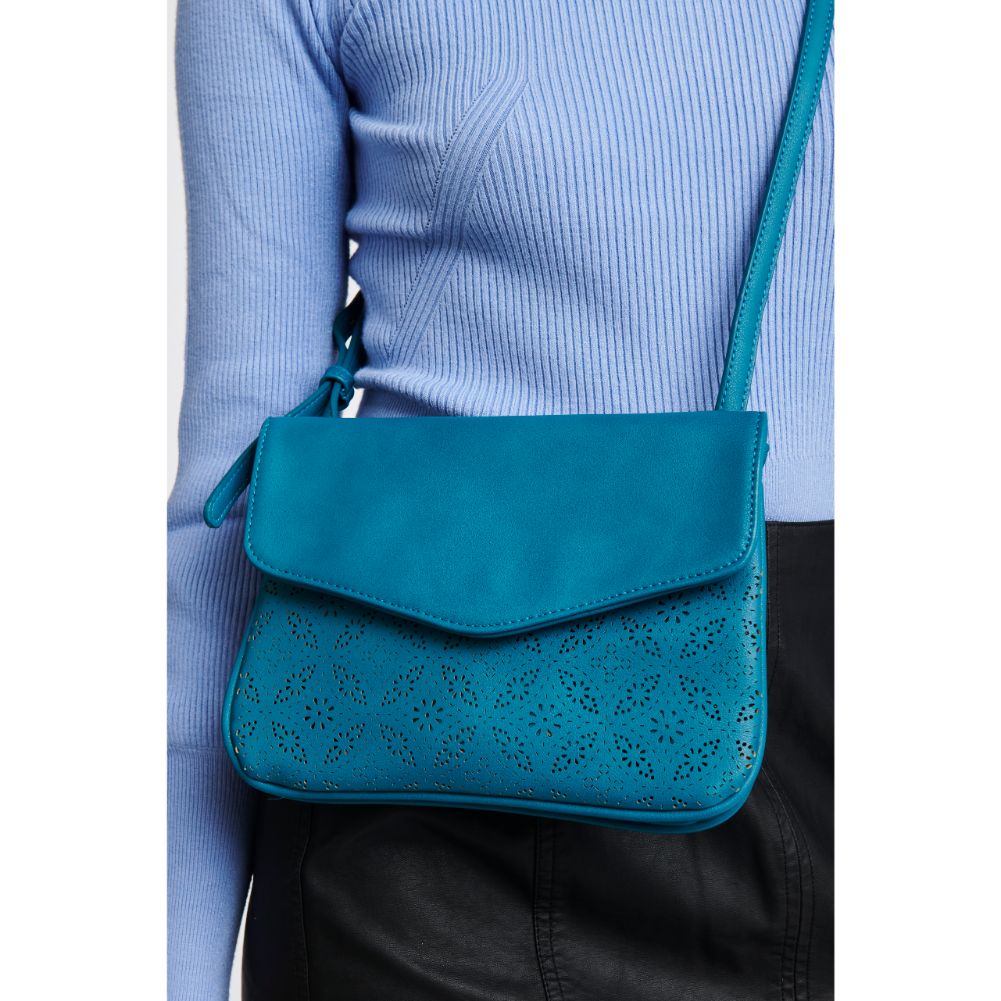 Woman wearing Teal Moda Luxe Tate-Perf Crossbody 842017121404 View 2 | Teal