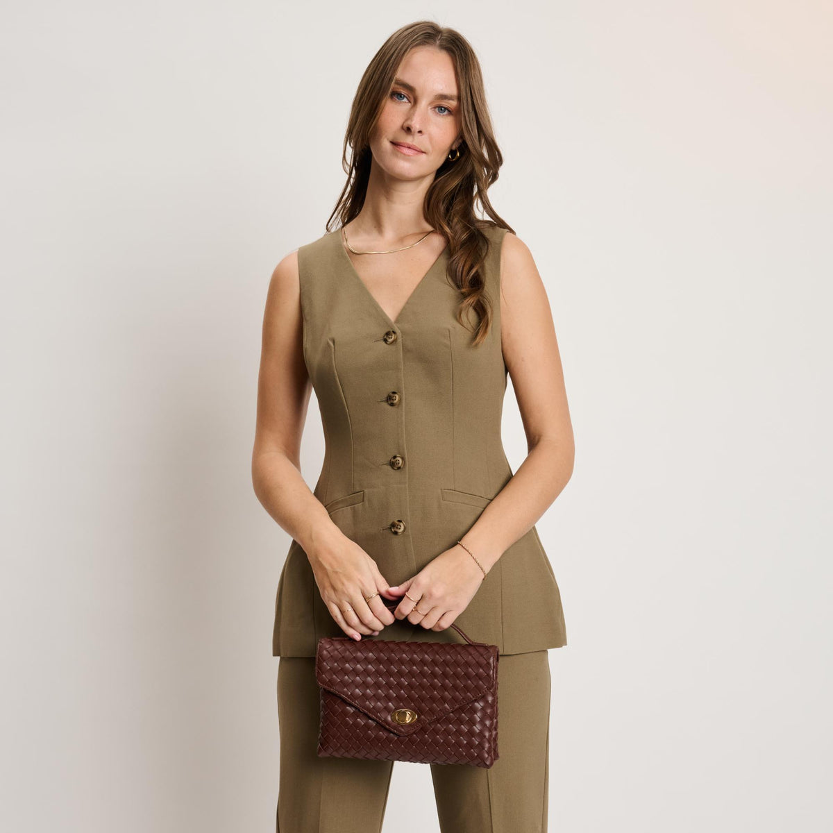 Woman wearing Chocolate Moda Luxe Harper Crossbody 842017139324 View 3 | Chocolate