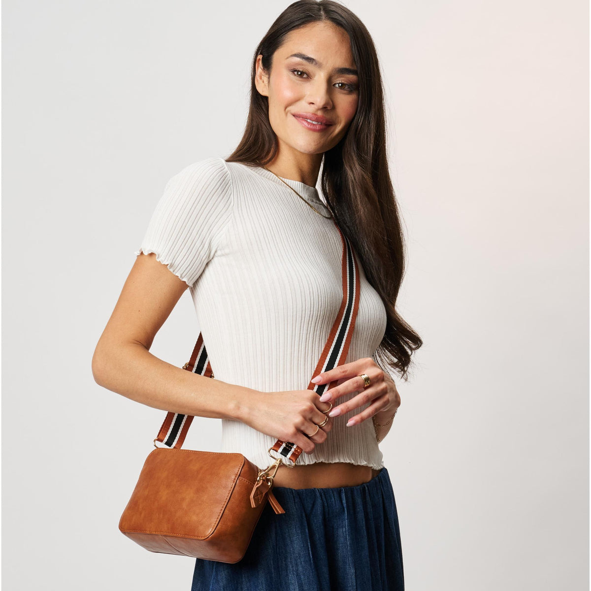 Woman wearing Tan Moda Luxe Skylie Crossbody 842017126706 View 1 | Tan