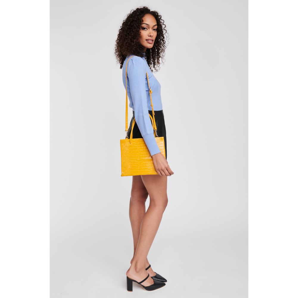 Woman wearing Mustard Moda Luxe Pierce Mini Tote 842017125853 View 4 | Mustard