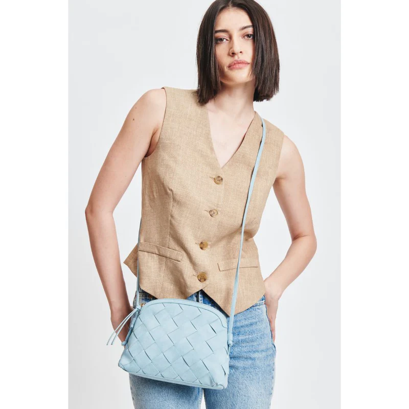 A woman carrying the Calista Crossbody