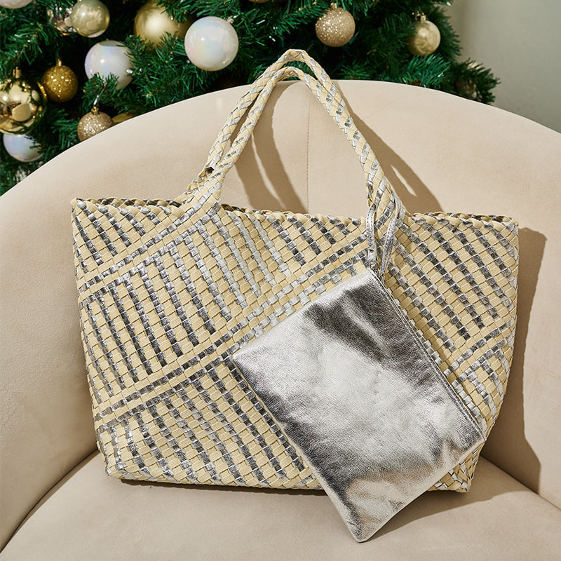 Woven tote bag with a metallic pocket on a beige chair with a Christmas tree in the background