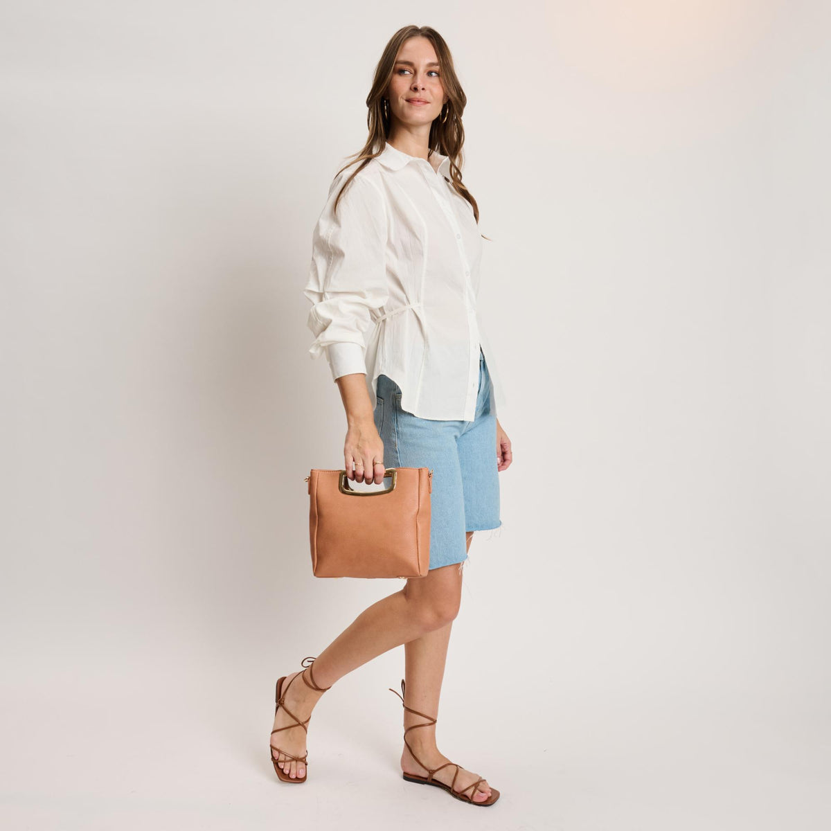 Woman wearing Salmon Moda Luxe Brielle Crossbody 842017141501 View 2 | Salmon