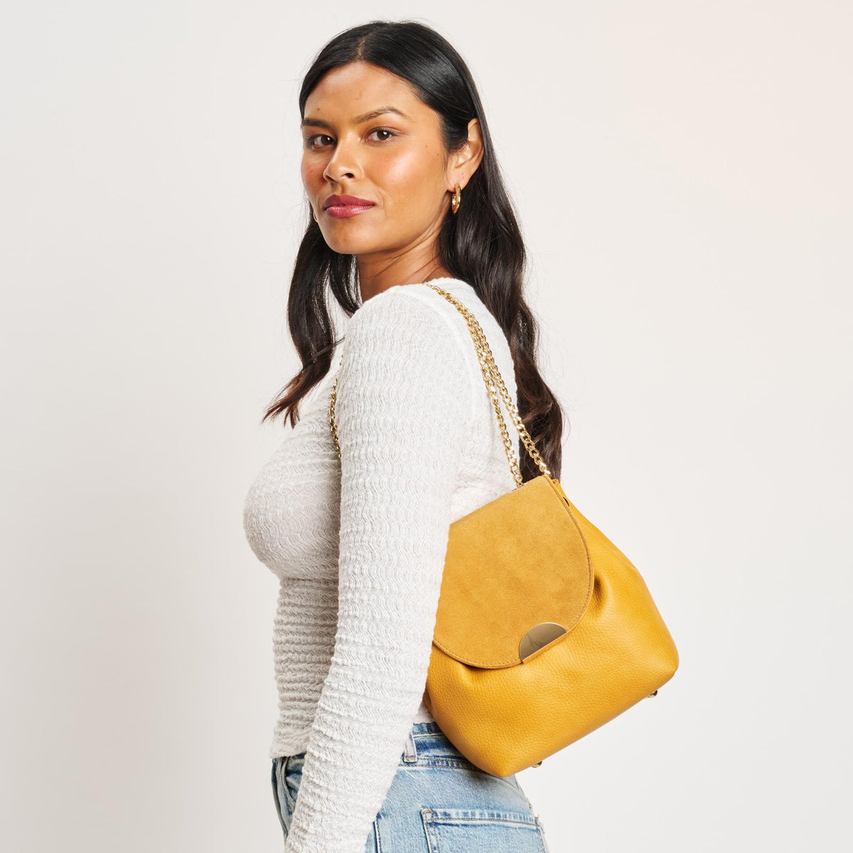 Woman wearing Mustard Moda Luxe Breanna Crossbody 842017127956 View 1 | Mustard