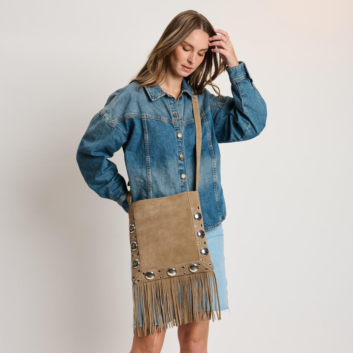 Woman wearing Sand Moda Luxe Courtney Crossbody 842017140573 View 1 | Sand