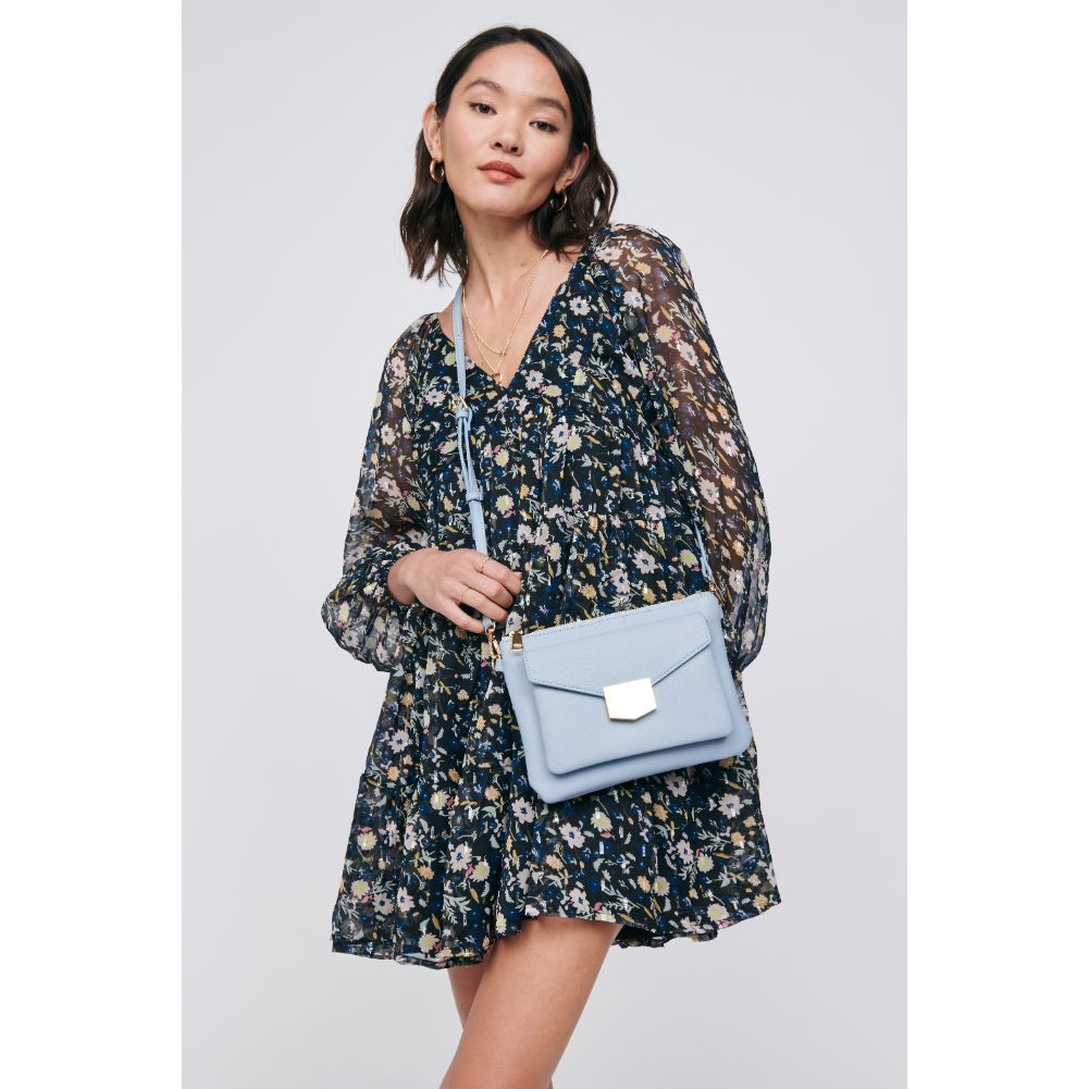 Woman wearing Sky Blue Moda Luxe Amari Crossbody 842017129172 View 1 | Sky Blue