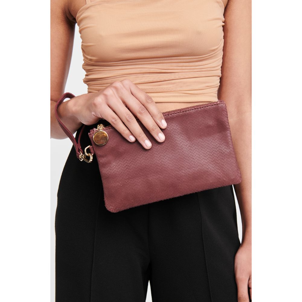Woman wearing Burgundy Moda Luxe Olivia Wristlet 842017117926 View 1 | Burgundy