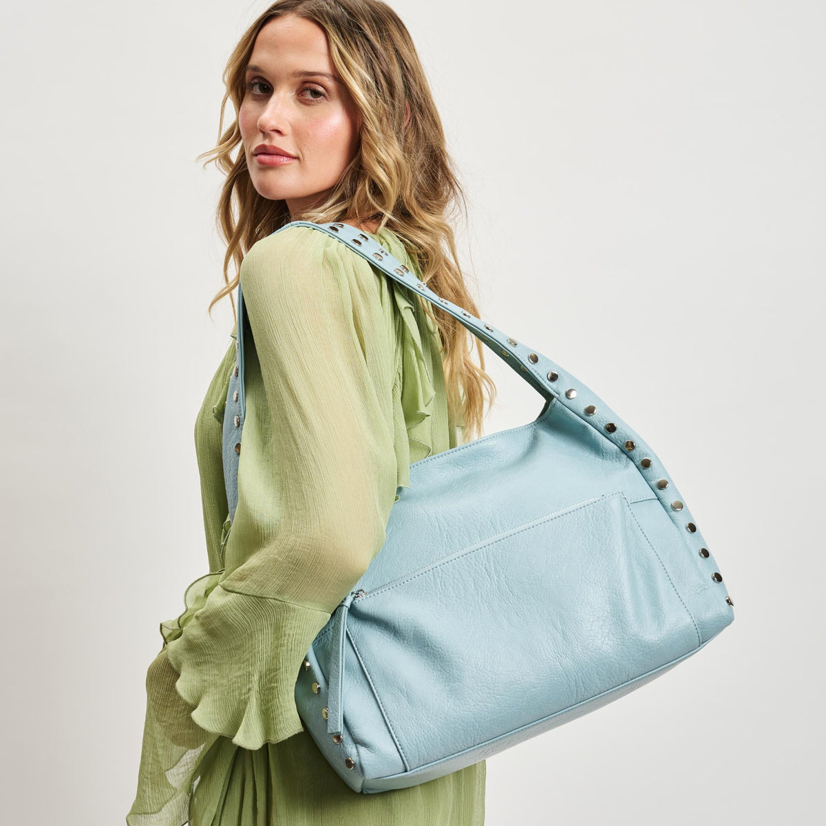 Woman wearing Ice Blue Sol and Selene Misty Hobo 842017137207 View 1 | Ice Blue