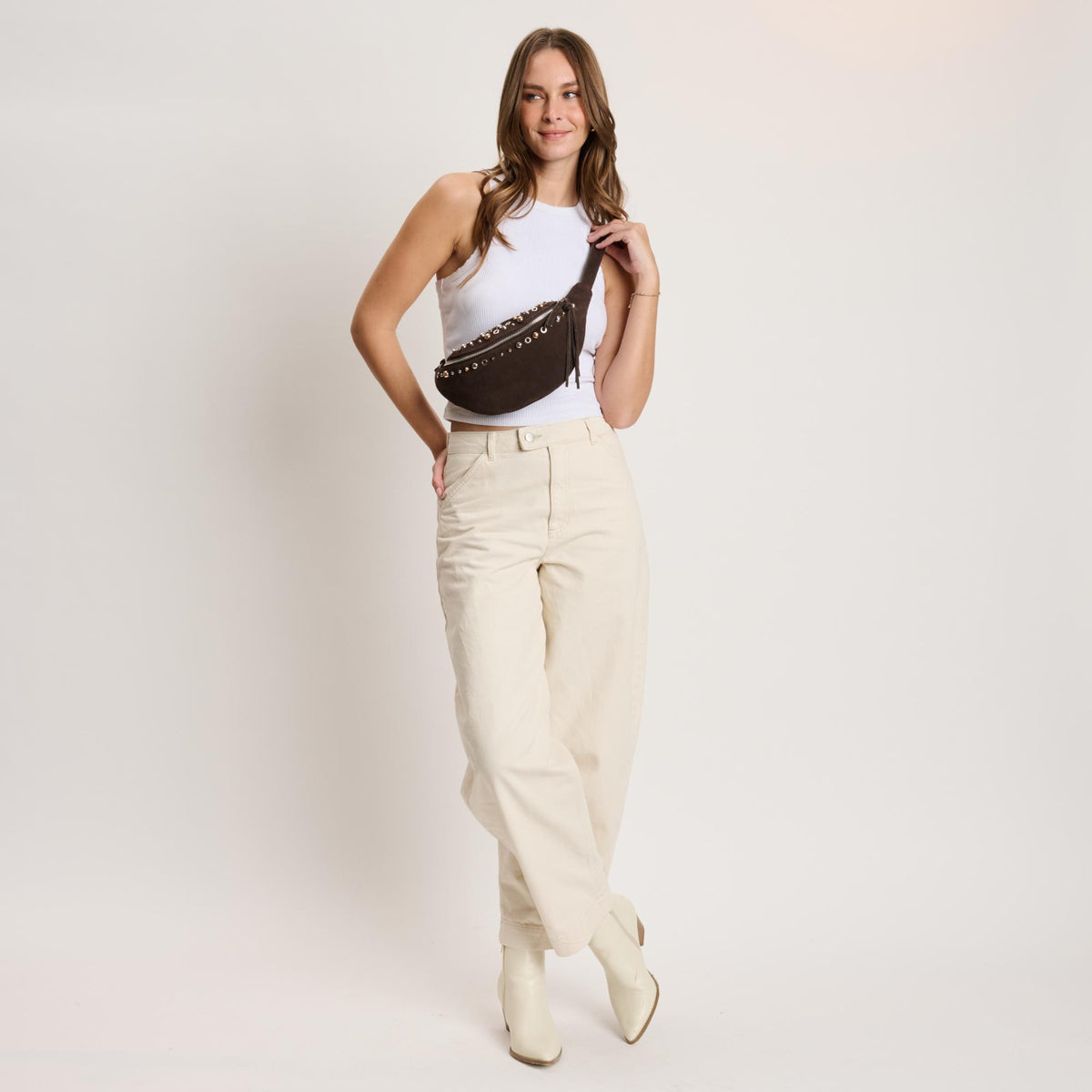 Woman wearing Chocolate Moda Luxe Star Belt Bag 842017140603 View 2 | Chocolate