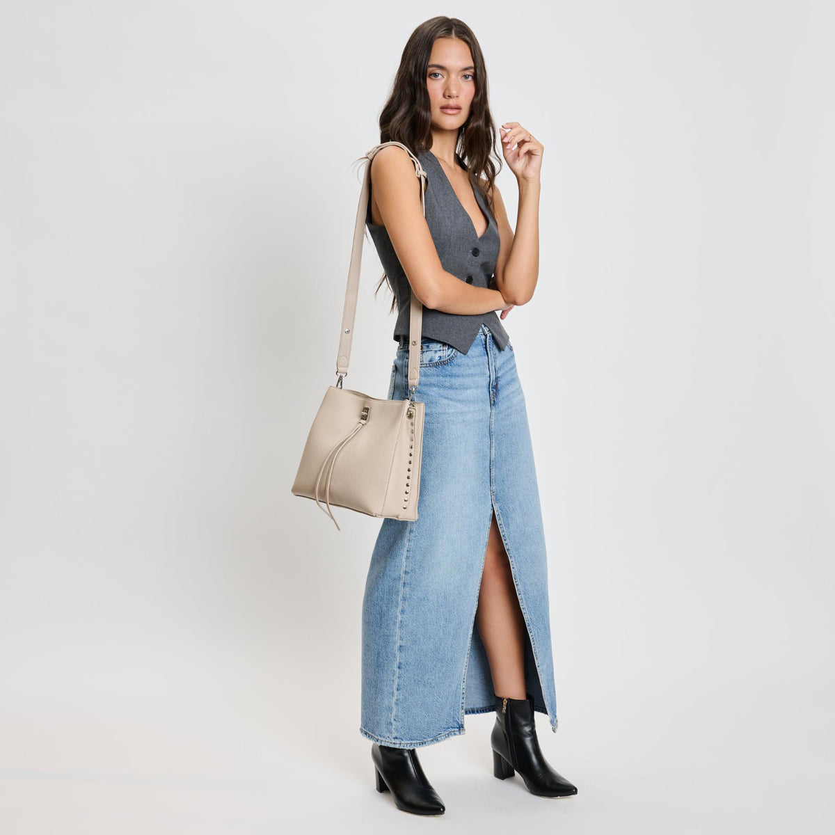 Woman wearing Almond Moda Luxe Eliza Crossbody 842017136064 View 2 | Almond