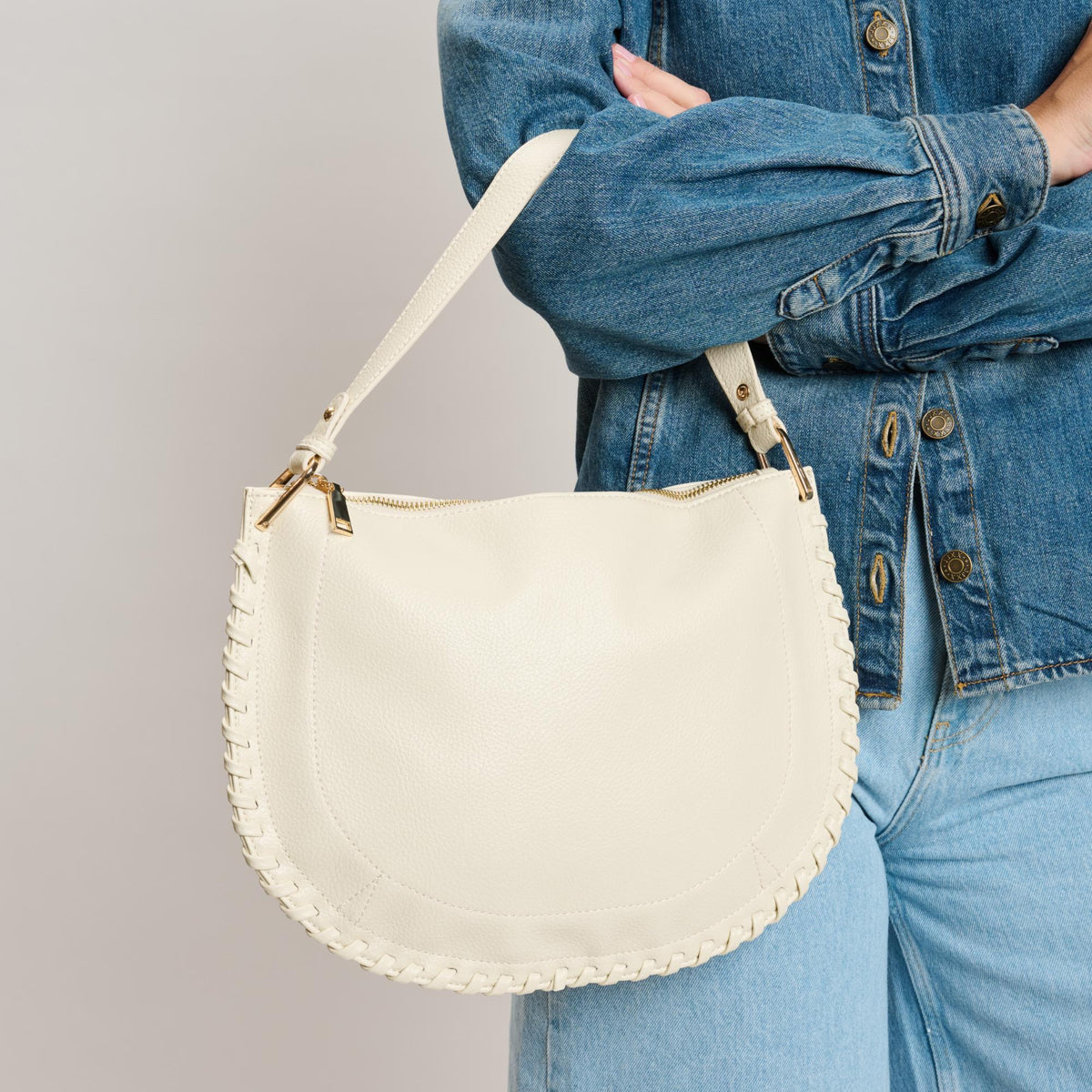 Woman wearing Ivory Moda Luxe Lita Hobo 842017141075 View 1 | Ivory