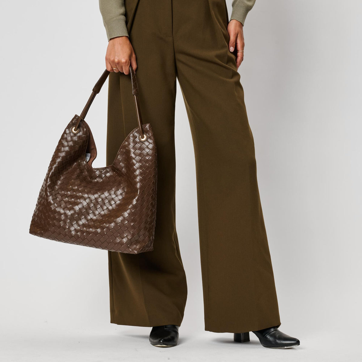 Woman wearing Chocolate Moda Luxe Ezia Hobo 842017142751 View 3 | Chocolate