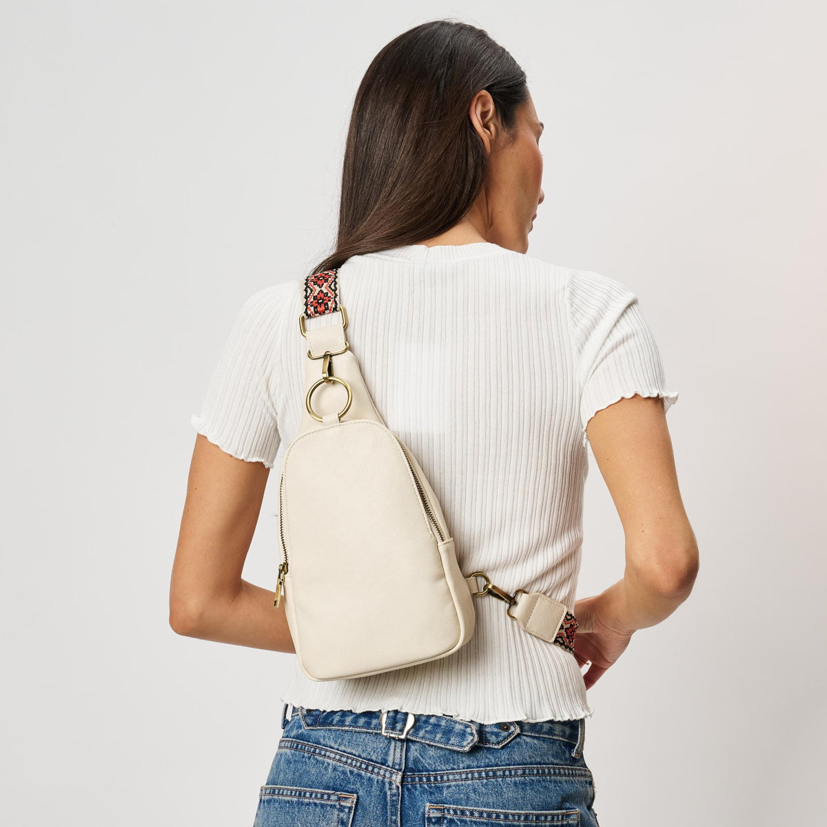 Woman wearing White Moda Luxe Regina Sling Backpack 842017142201 View 3 | White