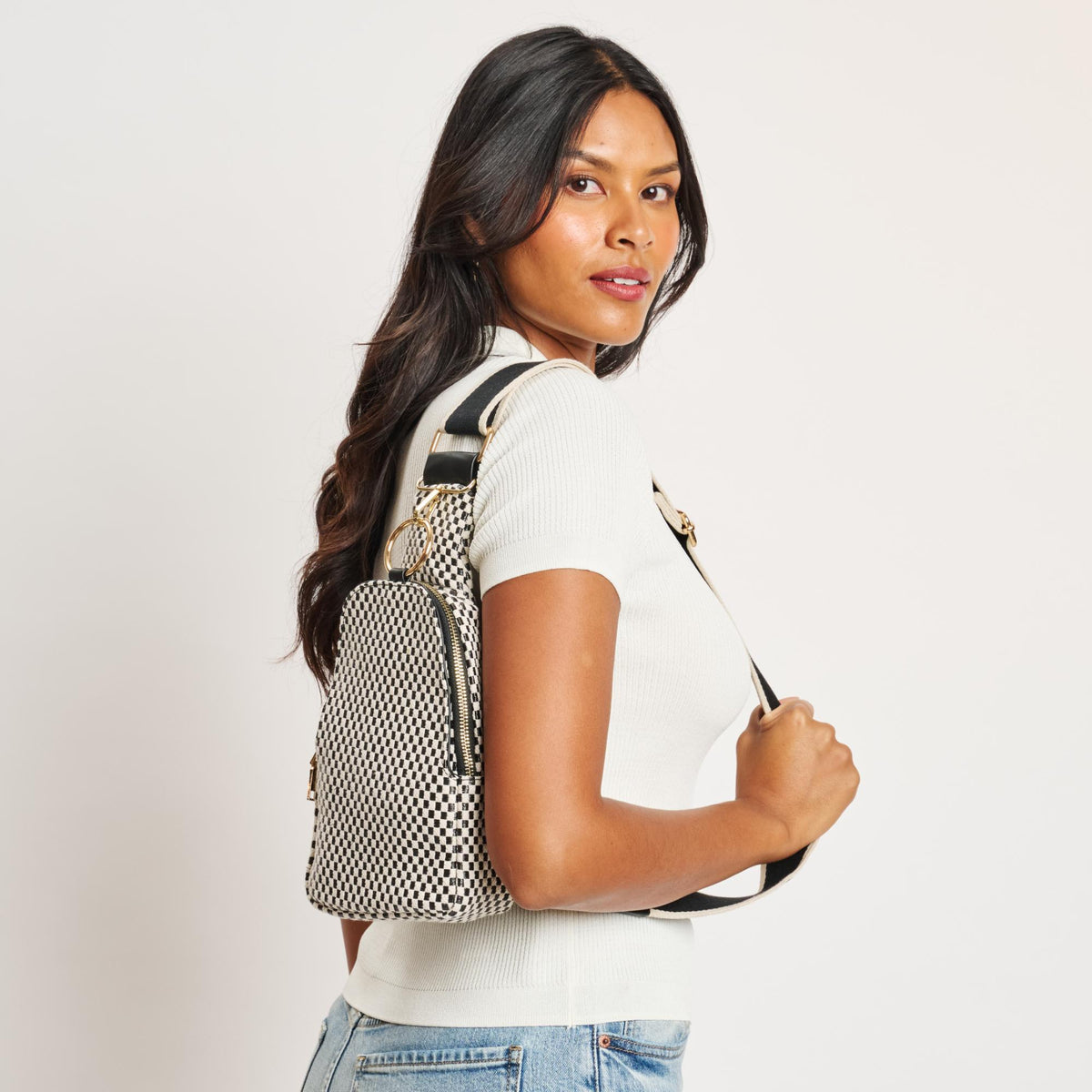 Woman wearing Black White Moda Luxe Regina - Checkered Sling Backpack 842017136194 View 3 | Black White