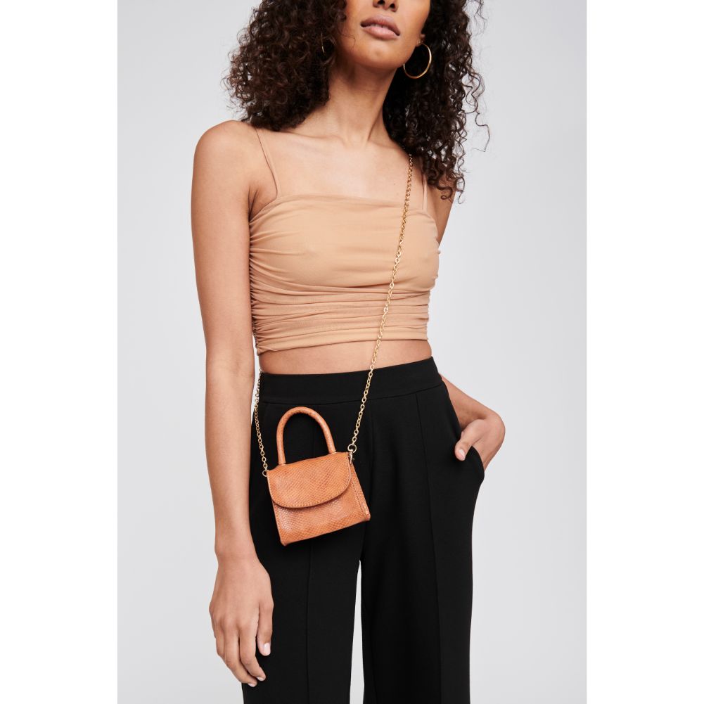 Woman wearing Tan Moda Luxe Farah Crossbody 842017127598 View 1 | Tan