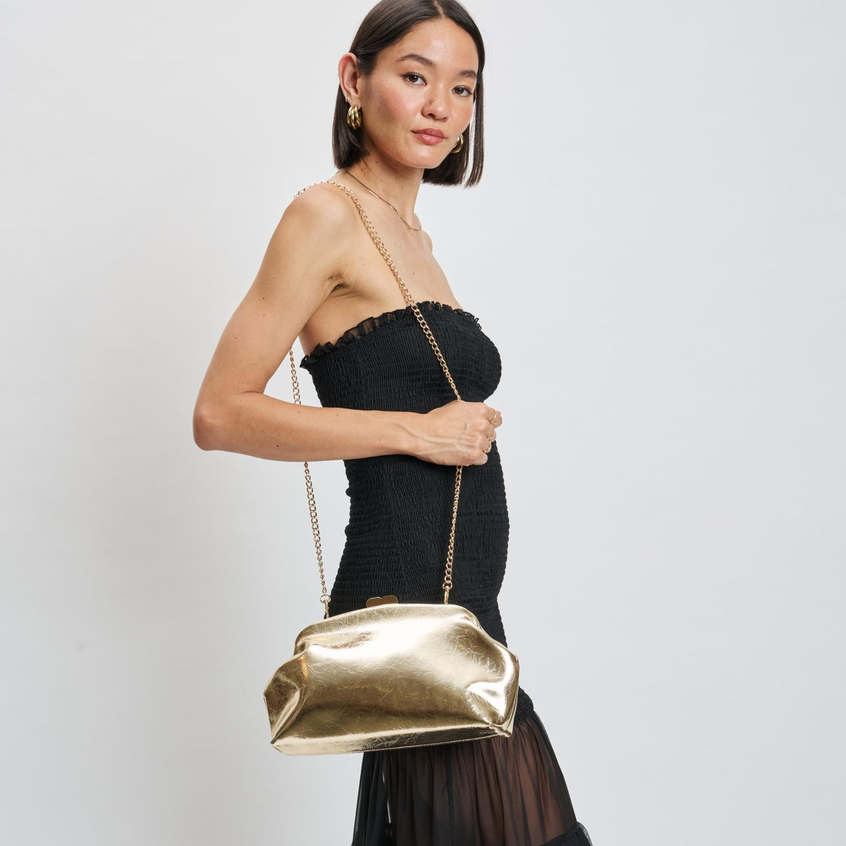 Woman wearing Gold Moda Luxe Camille Clutch 842017139195 View 3 | Gold