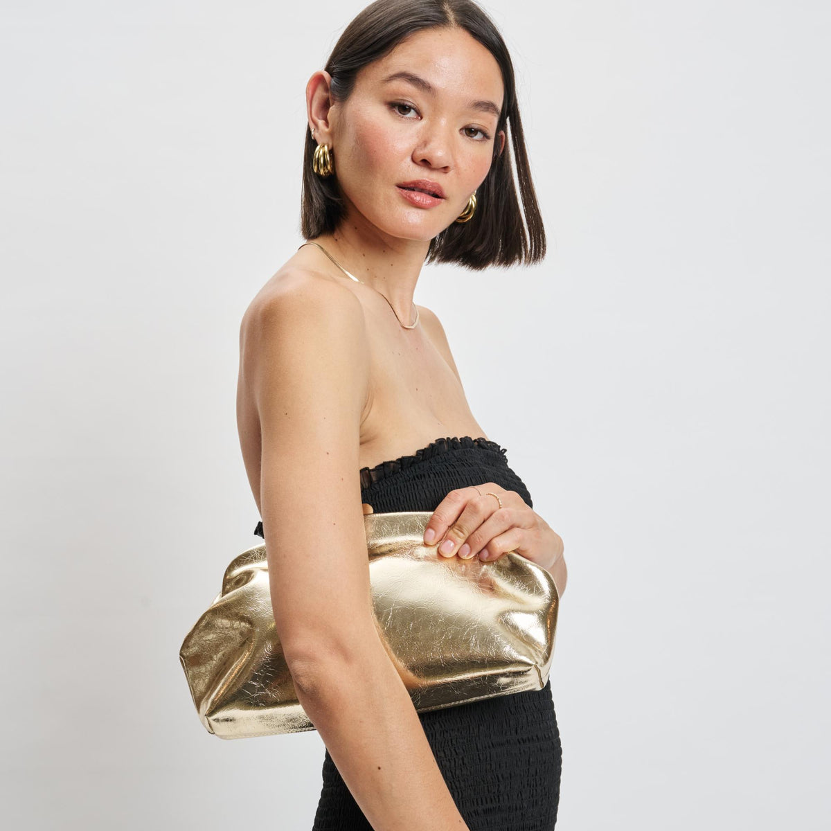 Woman wearing Gold Moda Luxe Camille Clutch 842017139195 View 2 | Gold