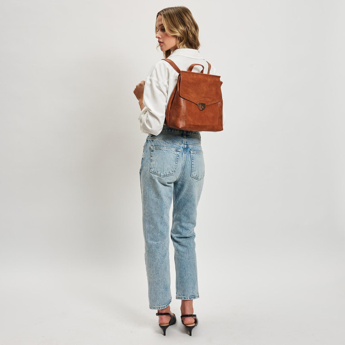 Woman wearing Tan Moda Luxe Lynn Backpack 842017119456 View 3 | Tan