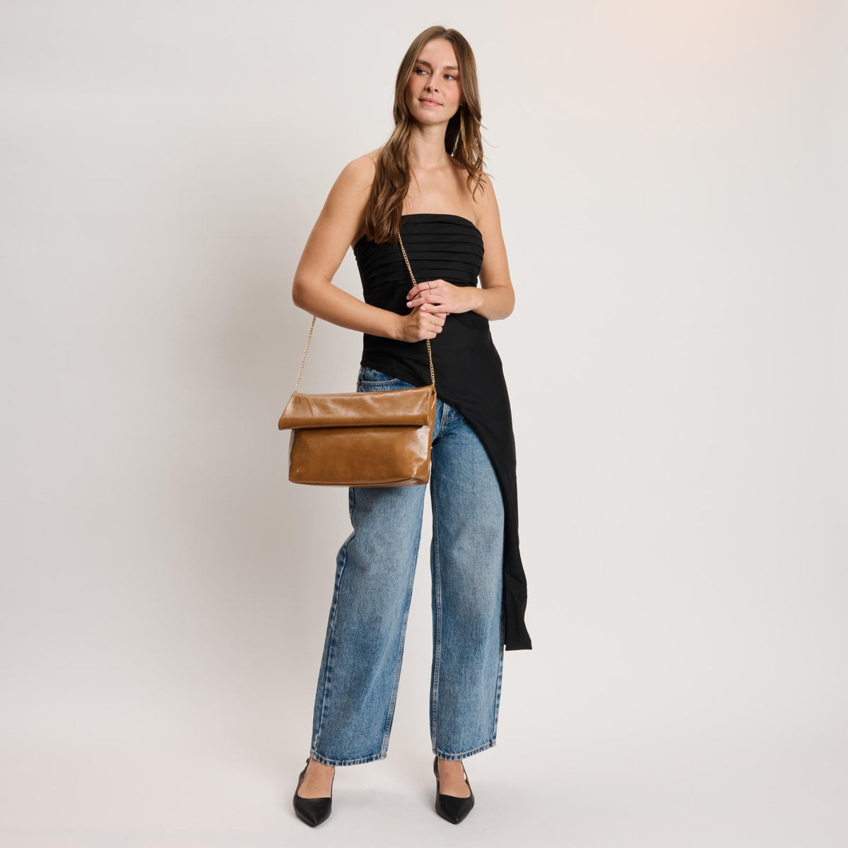 Woman wearing Caramel Moda Luxe Angela Crossbody 842017141662 View 2 | Caramel