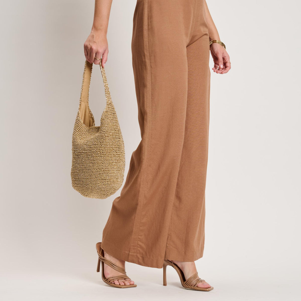 Woman wearing Gold Moda Luxe Starla Tote 842017141143 View 3 | Gold