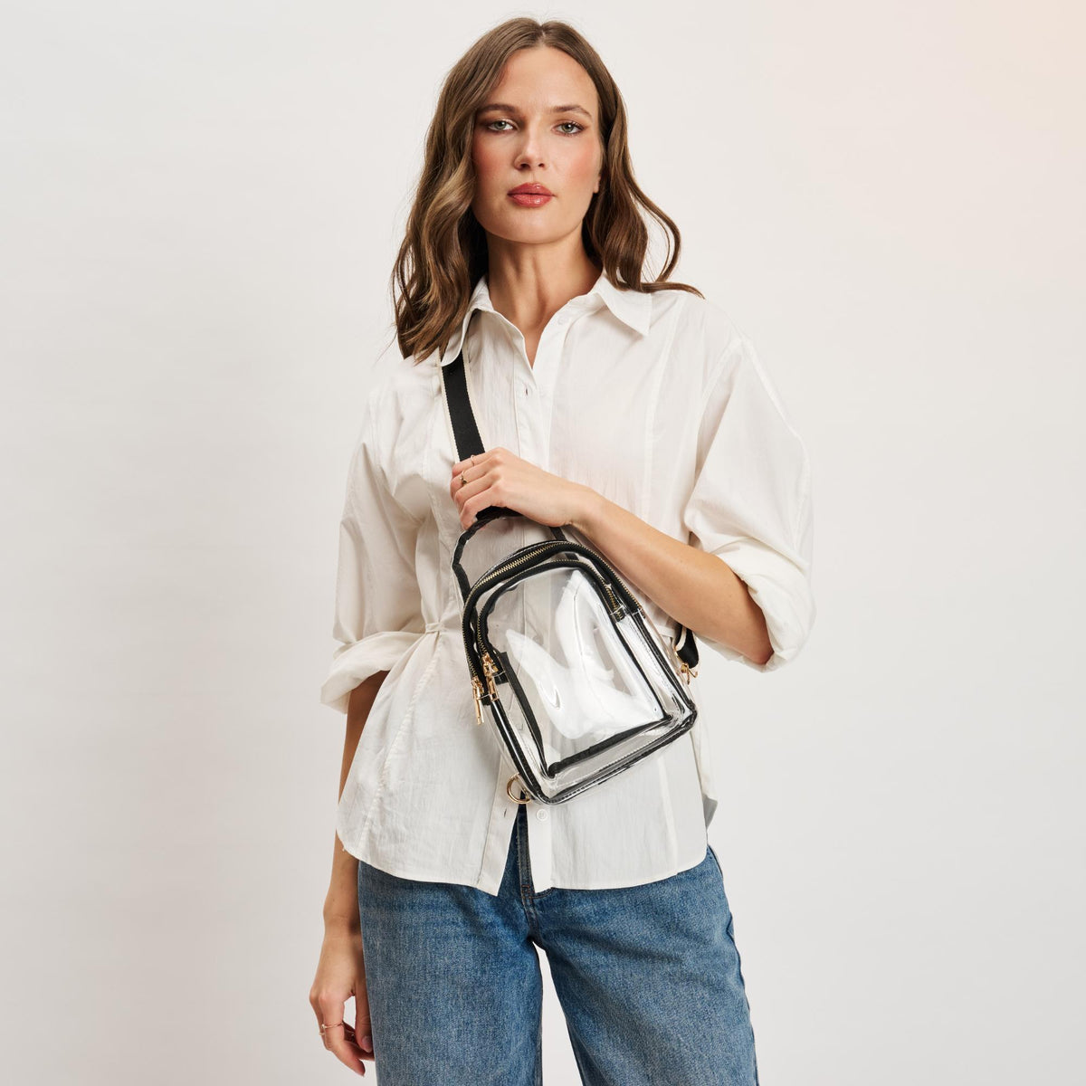 Woman wearing Clear Black Moda Luxe Britney Sling Backpack 842017133513 View 1 | Clear Black