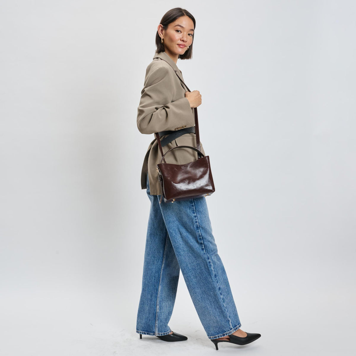 Woman wearing Chocolate Moda Luxe Sophie Crossbody 842017139508 View 2 | Chocolate